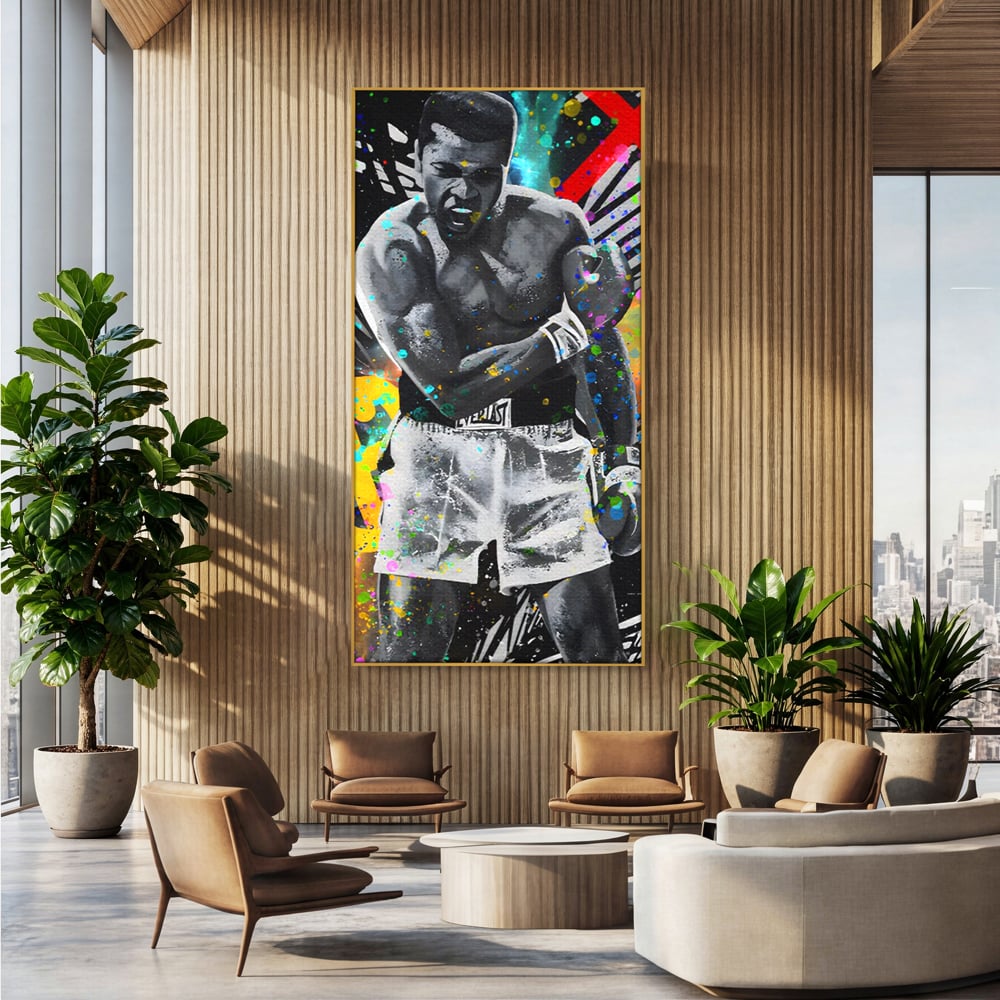 Tablou canvas cu tablou canvas cu muhammad ali in alb si negru, in rama de aluminiu auriu, pe perete intr-un birou